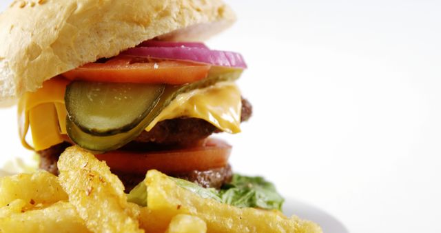 Close-up of Delicious Cheeseburger with Fries on White - Download Free Stock Images Pikwizard.com