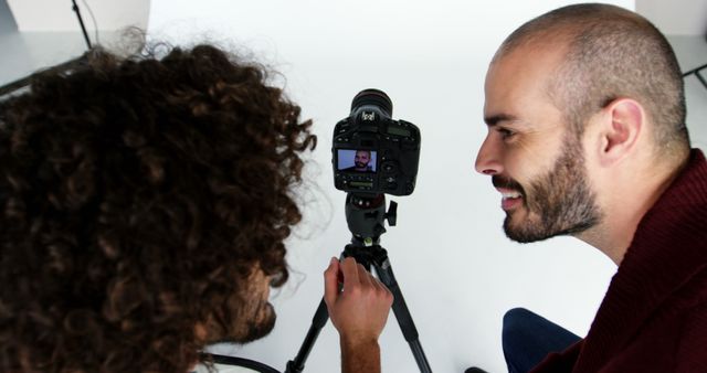 Men Checking Photos on Camera Screen in Studio - Download Free Stock Images Pikwizard.com