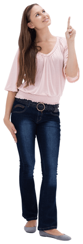 Happy young woman in pink shirt pointing upwards transparently
