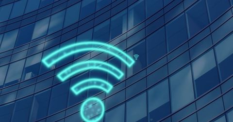 Digital wifi icons over modern building facade