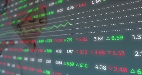 Finance Expert Analyzing Stock Prices in Modern Trading Room
