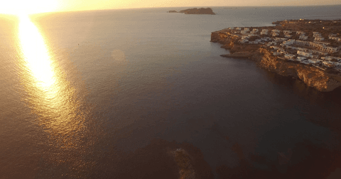 transparent sunset over ocean and coastal cliffs - Download Free Stock Videos Pikwizard.com