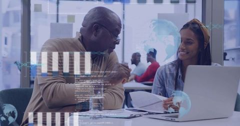 Intergenerational mentoring with data overlays: diverse woman and tutor collaborating on laptop