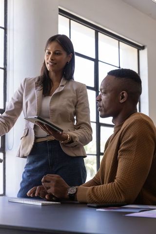 Team collaboration in modern office with tablet and keyboard