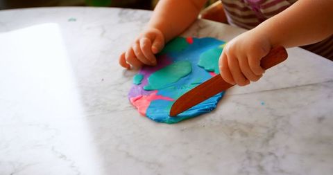 Child Molding Colorful Clay at Home on Sunlit Marble Table - Download Free Stock Images Pikwizard.com