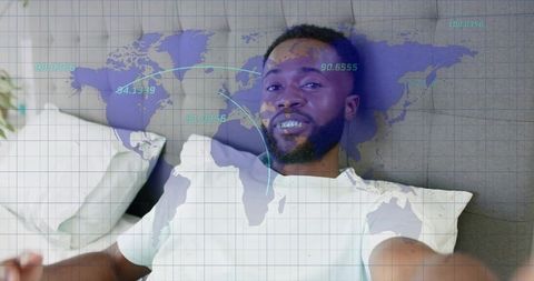 Young black man reclining on couch using smartphone with ar world map overlay