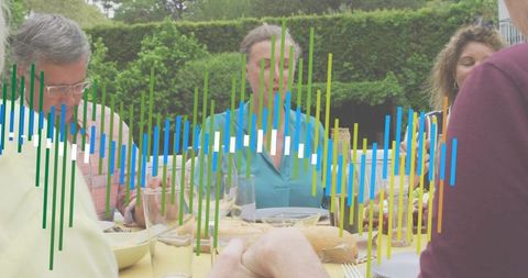 Backyard family sharing bread at outdoor table with colorful data bar overlay