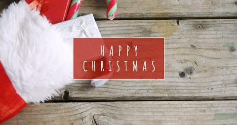 Festive Red Christmas Stocking on Rustic Wood Background