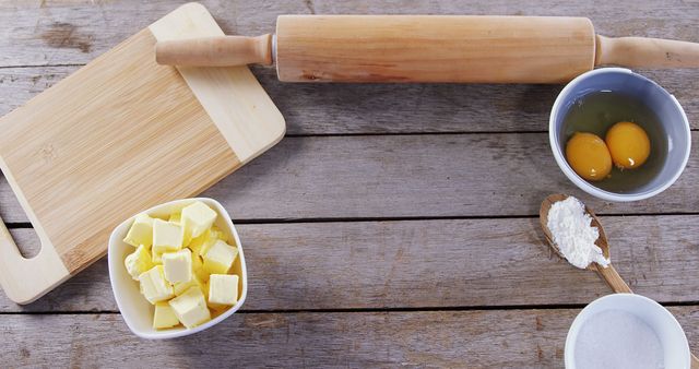 Baking Preparation with Rolling Pin, Eggs, and Butter on Rustic Wooden Table - Download Free Stock Images Pikwizard.com