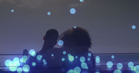 Dreamy Beachside Embrace with Abstract Lights