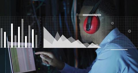 It technician monitoring network analytics in data center with touchscreen dashboard