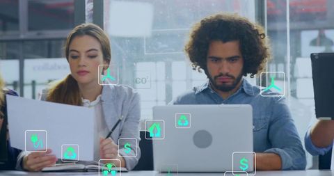 Young Professionals Collaborating on Sustainable Finance Using AR Data Visualization Tools