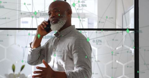 Businessman Discussing Future Innovations Over Phone with Network Overlays