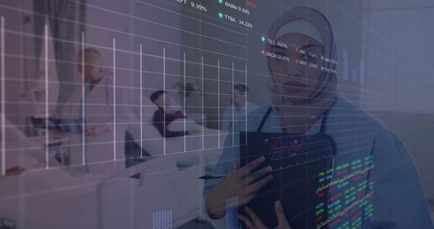 Clinician in headscarf monitoring patient data with digital health analytics overlay
