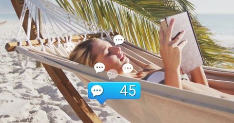 Woman Reading in Beach Hammock with Message Notifications