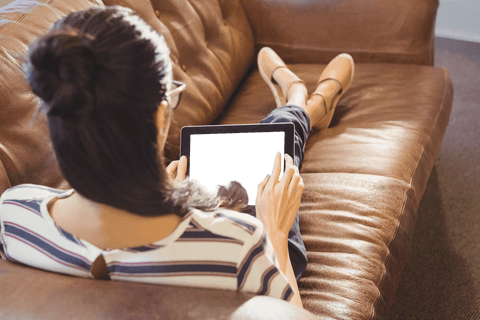 transparent tablet used by businesswoman relaxing on sofa - Download Free Stock Videos Pikwizard.com