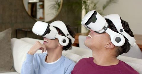 Hispanic Friends Enjoying Virtual Reality Experience Together