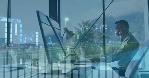 Professional Analyzing Stock Charts in Modern Office at Night