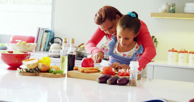 Mother and Daughter Cooking Fresh Vegetables in Modern Kitchen - Download Free Stock Images Pikwizard.com