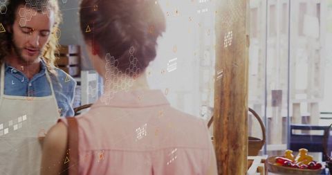 Customer Ordering at Rustic Cafe Counter with Attentive Attendant