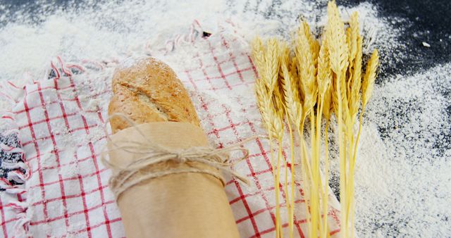 Freshly Baked Bread and Wheat on Flour-Dusted Surface - Download Free Stock Images Pikwizard.com