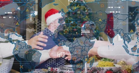 Family exchanging christmas gifts in santa hats at holiday dinner with global tech overlay