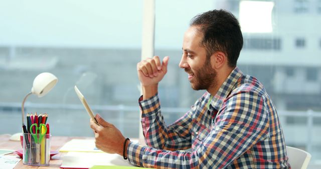 Man Reading Tablet Screen at Modern Office Workspace - Download Free Stock Images Pikwizard.com