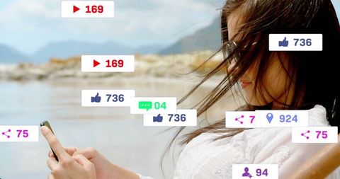 Woman Exploring Social Media on Smartphone by Lakeside