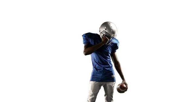 American Football Player Contemplating with Ball Against White Background - Download Free Stock Images Pikwizard.com