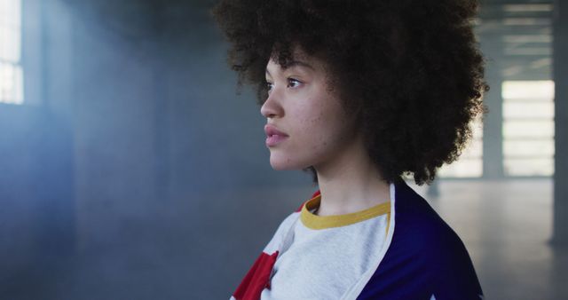 Young Woman with Natural Hair Staring Into Distance - Download Free Stock Images Pikwizard.com