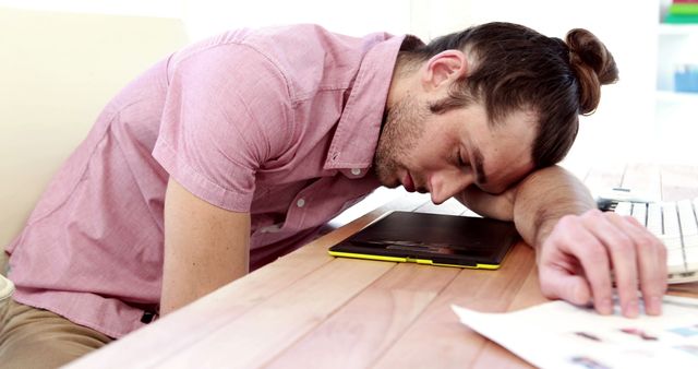 Tired Young Man Asleep at Desk with Computer and Tablet - Download Free Stock Images Pikwizard.com