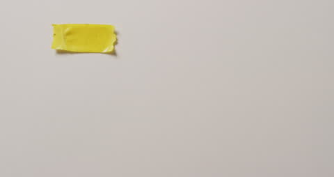 Torn Yellow Tape on Clean White Background with Copy Space