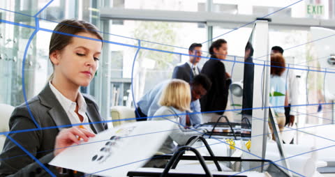 Business Team Office Collaboration Amidst Dynamic Digital Graphics