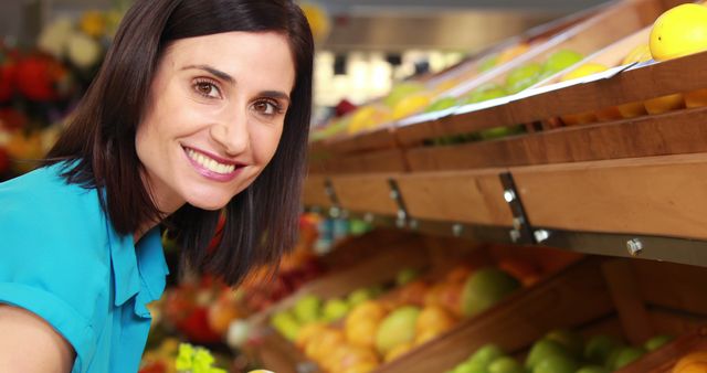 Smiling Woman Choosing Fresh Produce at Grocery Store - Download Free Stock Images Pikwizard.com