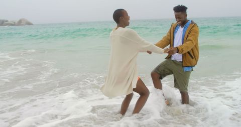 Romantic Couple Enjoying Playful Day at Beach