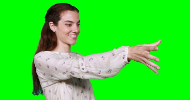 Smiling Woman Reaching Out with Hand on Green Screen Background - Download Free Stock Images Pikwizard.com