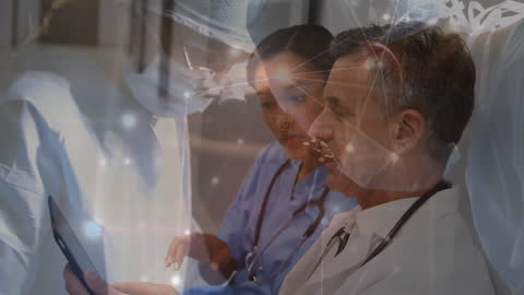 Medical Professionals Discussing Digital Data with Network Overlay