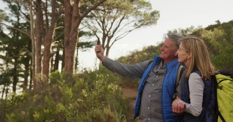 Senior Couple Taking Selfie While Hiking in Scenic Forest - Download Free Stock Images Pikwizard.com
