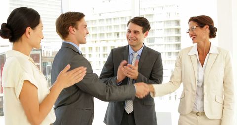 Business Team Applauding Successful Partnership Handshake - Download Free Stock Images Pikwizard.com