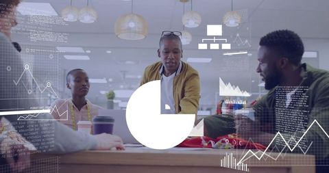 Leading team presenting interactive data visualizations in open-plan coworking meeting