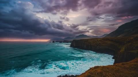 Remote Clifftop Coastline at Dusk with Dynamic Ocean Waves