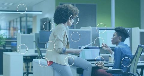 Business professionals collaborating in modern open-plan office