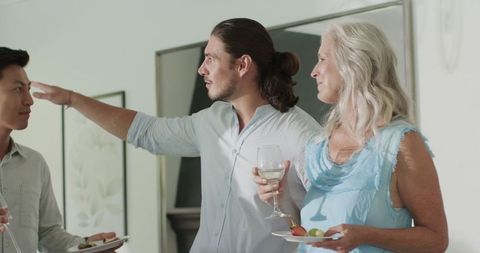 Guests conversing at sophisticated indoor celebration