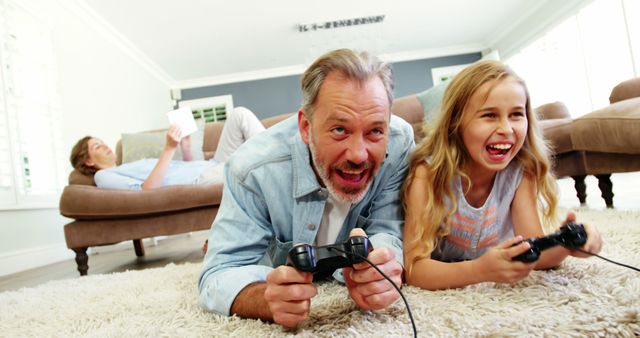 Father and Daughter Enjoying Video Game on Carpet - Download Free Stock Images Pikwizard.com