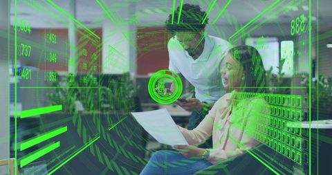 Reviewing Augmented Reality Dashboard in Open Office, Team Collaborating on Data Analytics