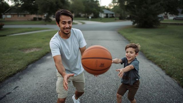 Playing Street Basketball Together Father Passing Ball to Son on Quiet Neighborhood Road