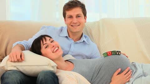 Expecting Couple Enjoying Relaxed Time at Home