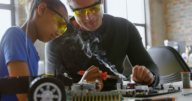 Father and Daughter Building Robot Together Using Soldering Tools - Download Free Stock Images Pikwizard.com