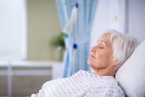 Senior Woman Resting Peacefully in Hospital Setting