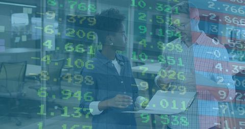 Collaborating professionals analyzing live market data overlay in modern office workspace